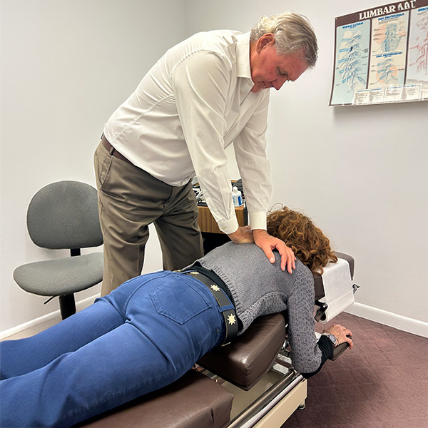 Dr. Schmetterling giving a patient an adjustment