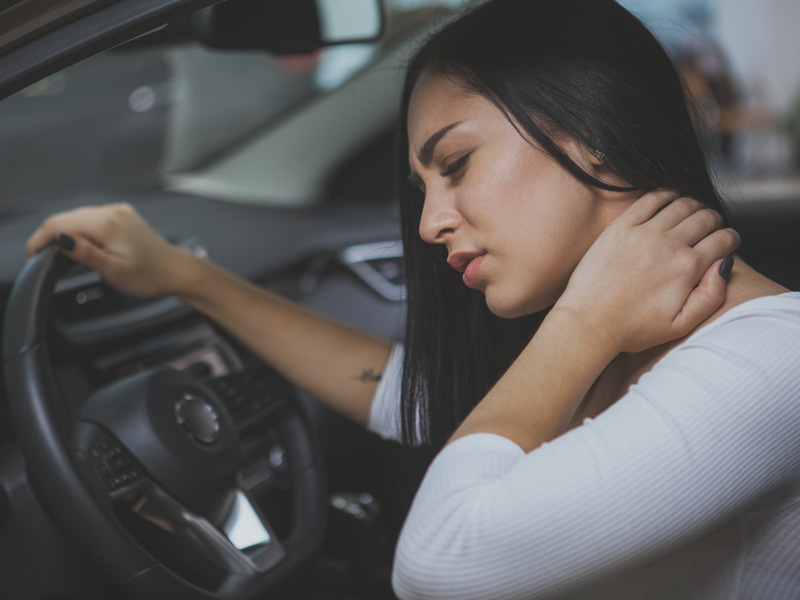 Woman with neck pain from auto accident